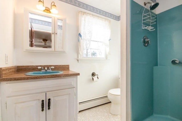 bathroom with a shower, tile patterned flooring, vanity, a baseboard heating unit, and toilet