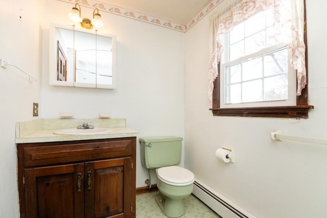 bathroom featuring vanity, a baseboard radiator, and toilet