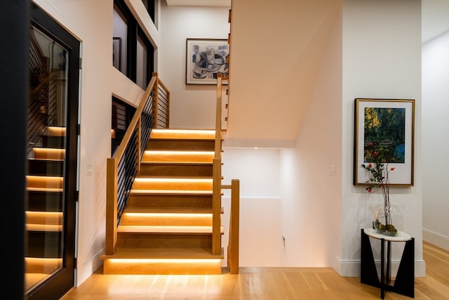 staircase featuring wood-type flooring