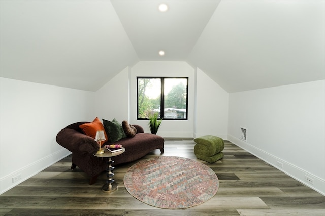 sitting room featuring wood-type flooring and lofted ceiling