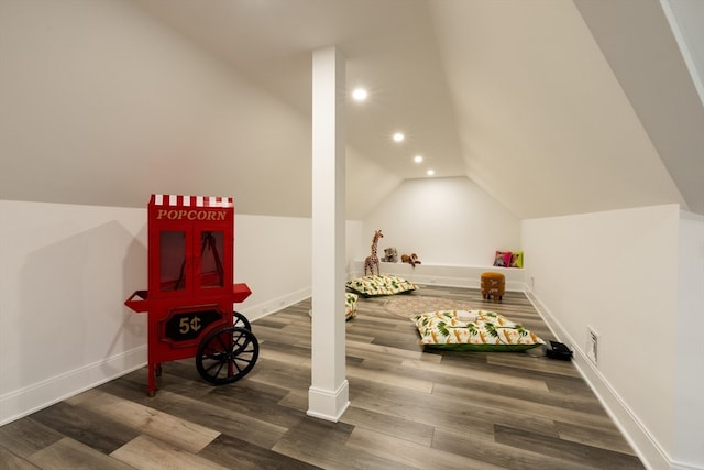 recreation room with hardwood / wood-style flooring and vaulted ceiling