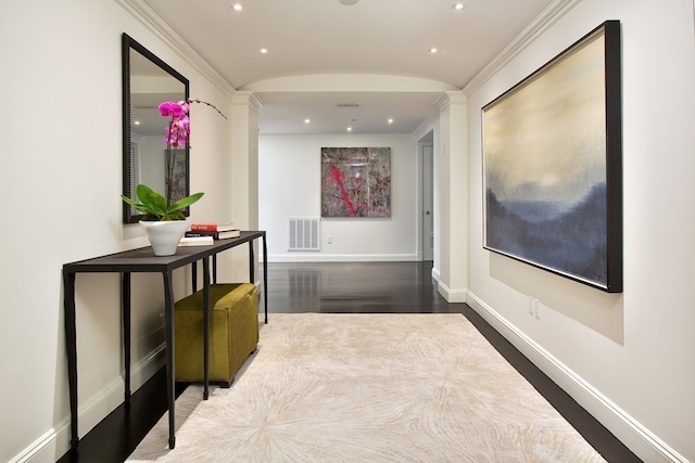 corridor with wood finished floors, recessed lighting, baseboards, and visible vents