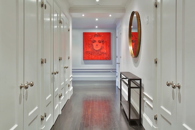 hallway with baseboards, dark wood-style floors, ornamental molding, and recessed lighting