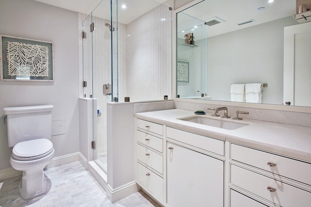 full bath featuring vanity, baseboards, toilet, and a shower stall