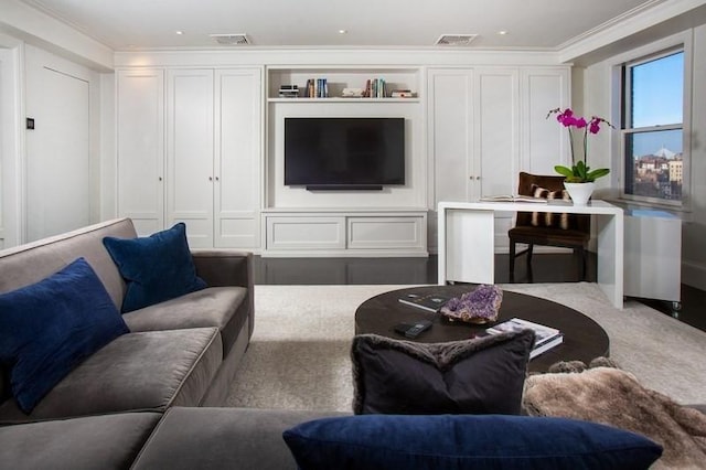 living area featuring carpet flooring, visible vents, crown molding, and a decorative wall