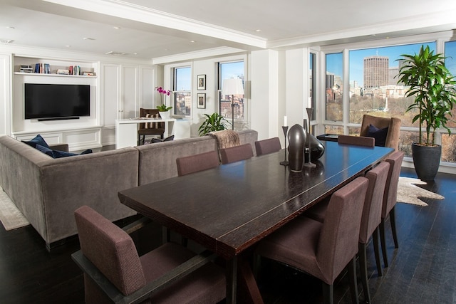 dining room featuring plenty of natural light, dark wood-type flooring, and crown molding