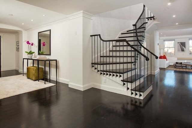 stairs featuring recessed lighting, crown molding, baseboards, and wood finished floors