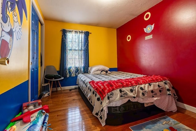 bedroom with wood-type flooring