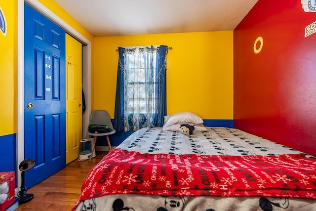 bedroom with hardwood / wood-style flooring