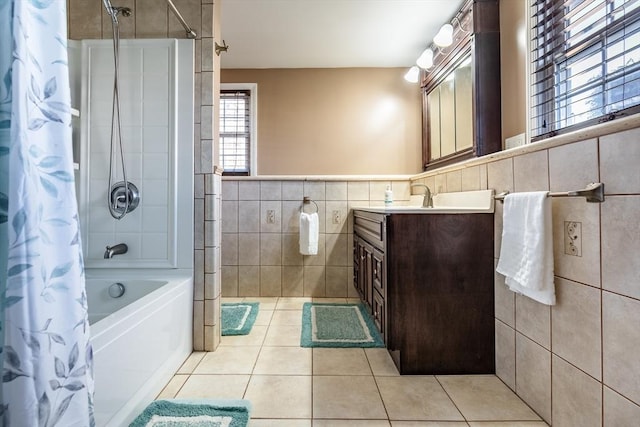 bathroom featuring shower / tub combo with curtain, tile walls, tile patterned flooring, and vanity