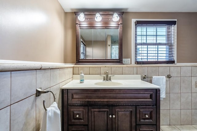 bathroom with tile walls and vanity