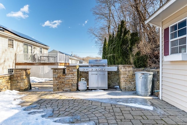 view of patio / terrace featuring a wooden deck and area for grilling