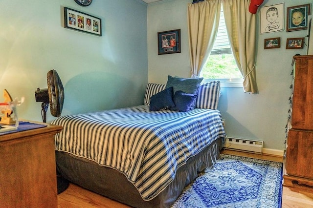 171 David Cir, Putnam, CT 06260 - bedroom with baseboard heating and wood finished floors