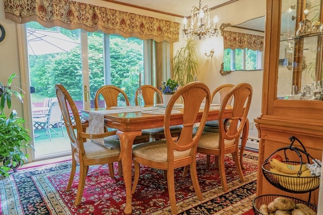 171 David Cir, Putnam, CT 06260 - dining area with a chandelier, ornamental molding, and a baseboard heating unit