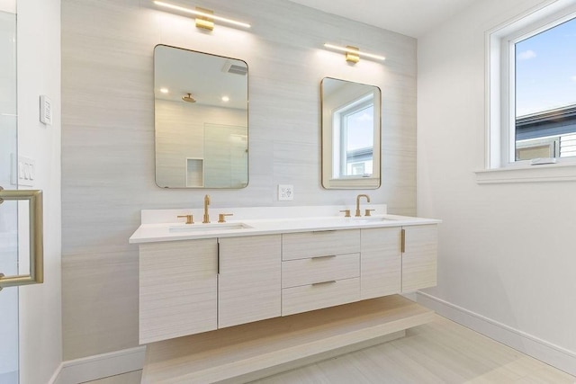 bathroom with a healthy amount of sunlight and vanity