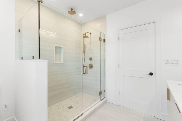 bathroom featuring an enclosed shower