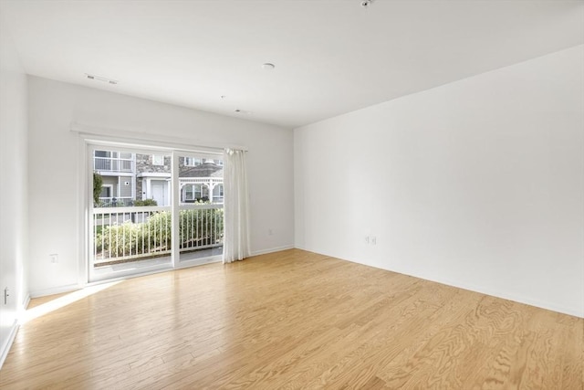 unfurnished room featuring light hardwood / wood-style flooring