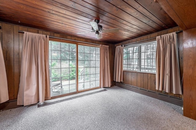 399 Elm St, East Longmeadow, MA 01028 - spare room featuring a baseboard heating unit, carpet floors, wooden walls, wooden ceiling, and ceiling fan