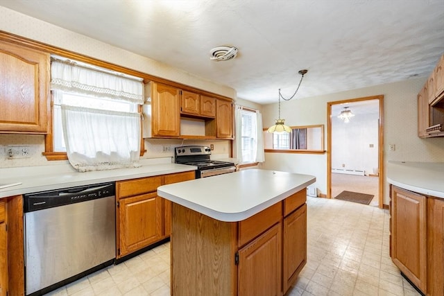 399 Elm St, East Longmeadow, MA 01028 - kitchen with stainless steel appliances, light flooring, light countertops, and a kitchen island
