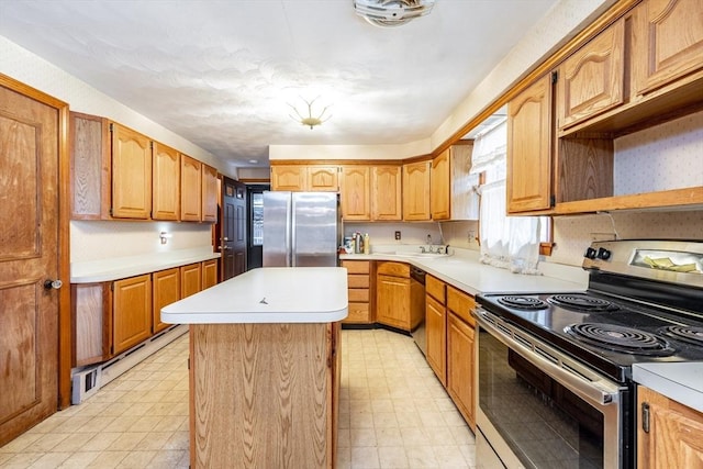 399 Elm St, East Longmeadow, MA 01028 - kitchen featuring stainless steel appliances, a kitchen island, light floors, and light countertops