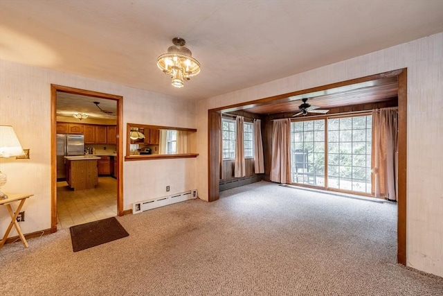 399 Elm St, East Longmeadow, MA 01028 - unfurnished living room featuring baseboard heating, light colored carpet, and a ceiling fan