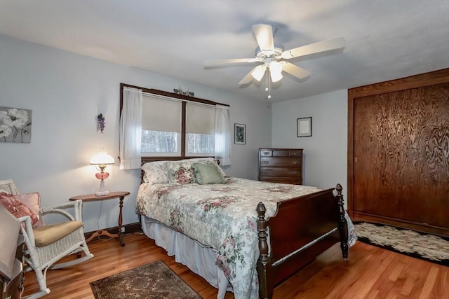 bedroom with ceiling fan and wood finished floors