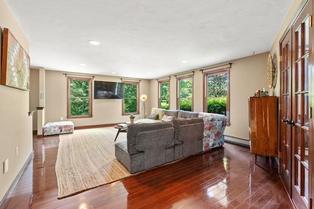 85 Green Meadow Ct, Northbridge, MA 01588 - living room with a baseboard heating unit, dark wood finished floors, baseboards, and recessed lighting