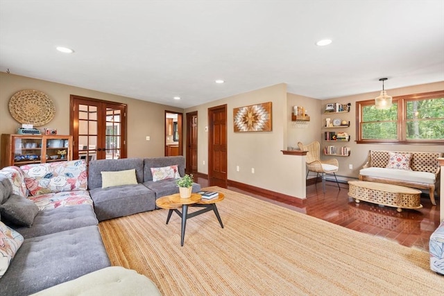 85 Green Meadow Ct, Northbridge, MA 01588 - living area with french doors, wood finished floors, baseboards, recessed lighting, and a baseboard radiator