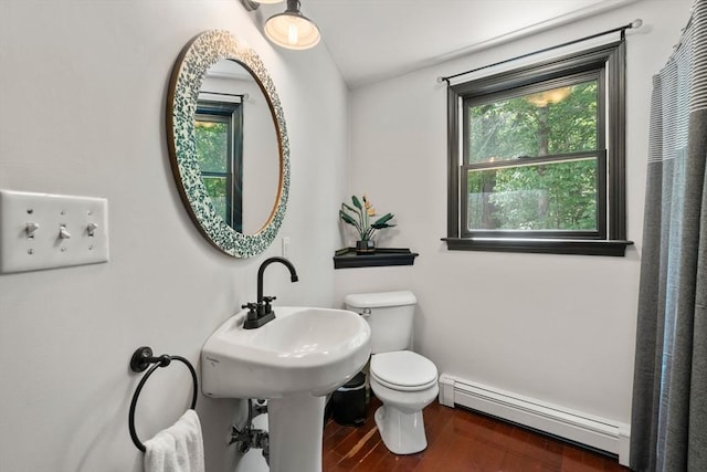 85 Green Meadow Ct, Northbridge, MA 01588 - bathroom featuring baseboard heating, toilet, wood finished floors, and baseboards