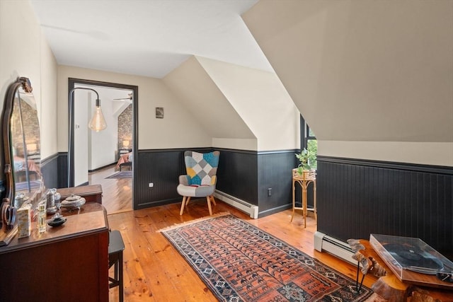 85 Green Meadow Ct, Northbridge, MA 01588 - home office with a baseboard radiator, a wainscoted wall, hardwood / wood-style floors, and lofted ceiling