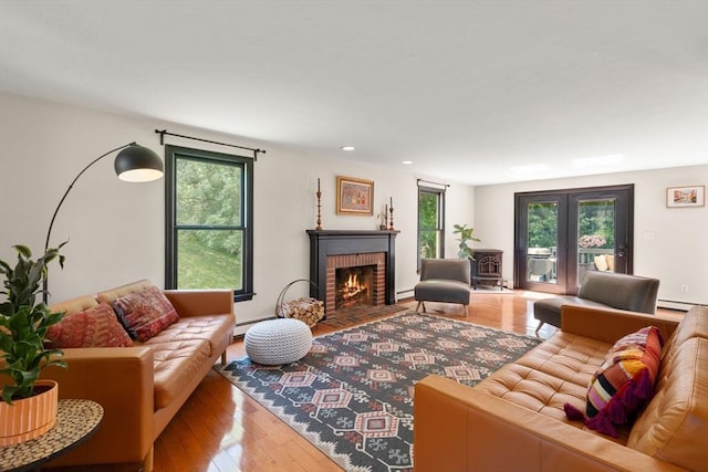 85 Green Meadow Ct, Northbridge, MA 01588 - living area with a fireplace, wood-type flooring, recessed lighting, baseboard heating, and a baseboard heating unit