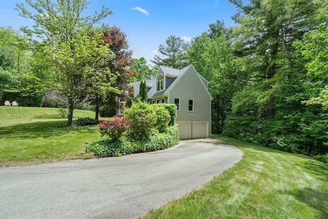 85 Green Meadow Ct, Northbridge, MA 01588 - view of side of home featuring a garage, a lawn, and driveway