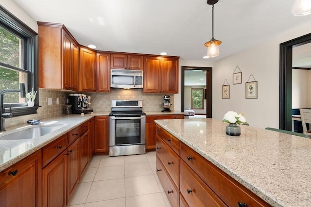 85 Green Meadow Ct, Northbridge, MA 01588 - kitchen with stainless steel appliances, a sink, tasteful backsplash, plenty of natural light, and recessed lighting