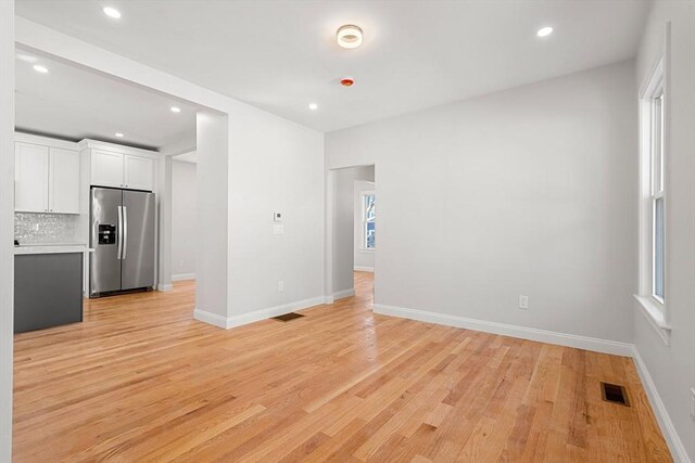 13 River St Unit 1, Danvers, MA 01923 - unfurnished living room with light wood-style floors, visible vents, and recessed lighting