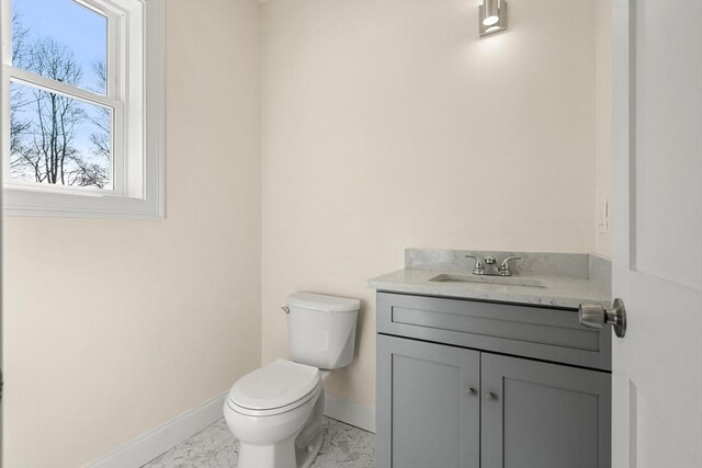 13 River St Unit 1, Danvers, MA 01923 - bathroom featuring baseboards, toilet, and vanity