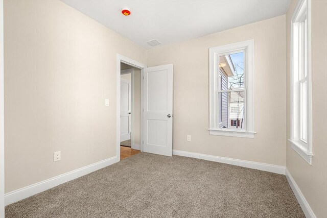 13 River St Unit 1, Danvers, MA 01923 - carpeted empty room featuring baseboards