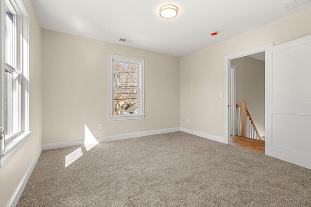 13 River St Unit 1, Danvers, MA 01923 - unfurnished room with baseboards, visible vents, and carpet flooring