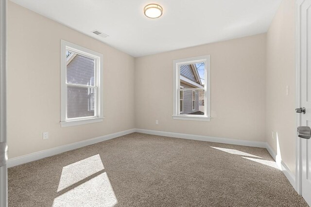 13 River St Unit 1, Danvers, MA 01923 - carpeted spare room featuring visible vents and baseboards
