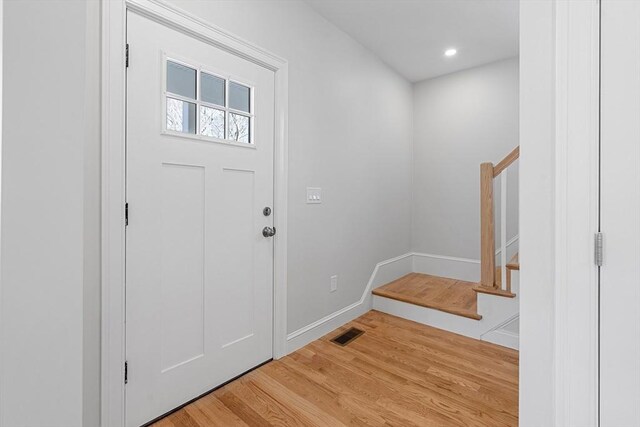 13 River St Unit 1, Danvers, MA 01923 - entryway with recessed lighting, stairway, wood finished floors, visible vents, and baseboards