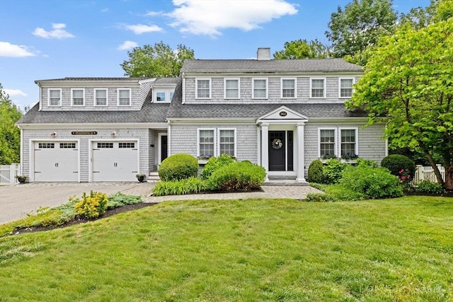 161 Hollett St, Scituate, MA 02066 - shingle-style home with asphalt driveway, a chimney, a garage, and a shingled roof