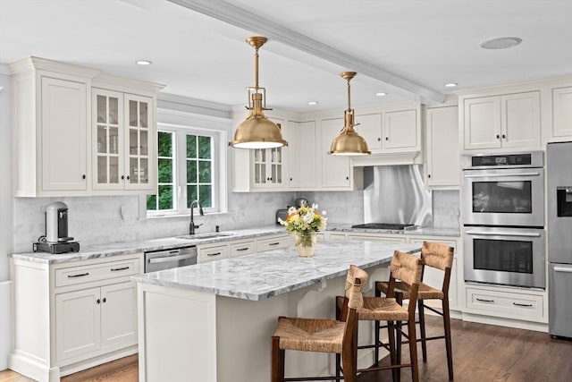 161 Hollett St, Scituate, MA 02066 - kitchen featuring stainless steel appliances, white cabinets, dark wood-style floors, recessed lighting, and beam ceiling