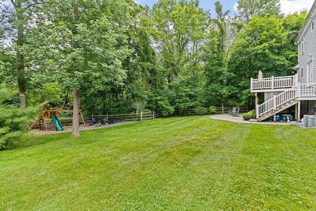 161 Hollett St, Scituate, MA 02066 - view of yard with stairway, a wooden deck, a playground, and a patio area