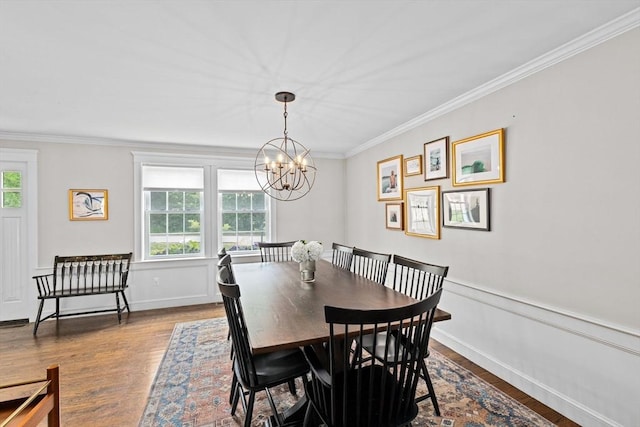 161 Hollett St, Scituate, MA 02066 - dining area with a chandelier, crown molding, and dark wood-style floors