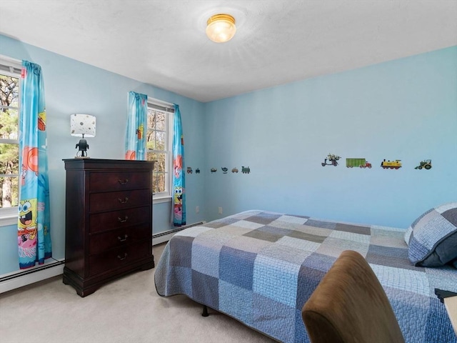 8 Kennedy Ln, Acton, MA 01720 - bedroom with light carpet and a baseboard radiator