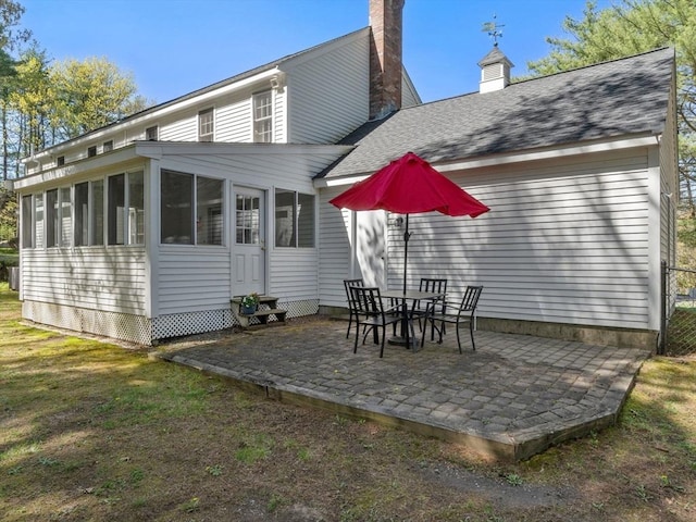8 Kennedy Ln, Acton, MA 01720 - rear view of property with a patio, a sunroom, a chimney, roof with shingles, and entry steps