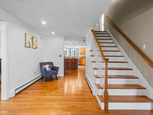 8 Kennedy Ln, Acton, MA 01720 - staircase with a baseboard heating unit, wood finished floors, and recessed lighting