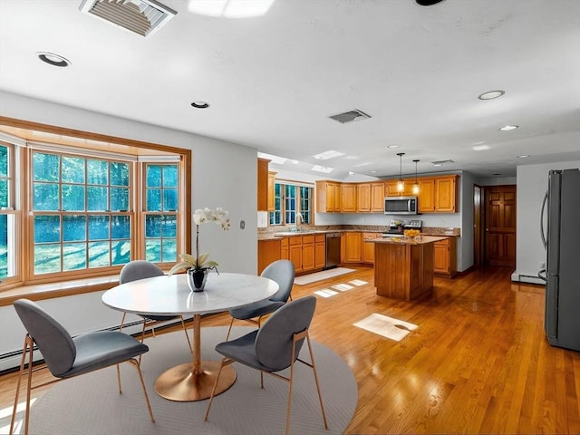8 Kennedy Ln, Acton, MA 01720 - dining space with recessed lighting, light wood-type flooring, and a baseboard radiator