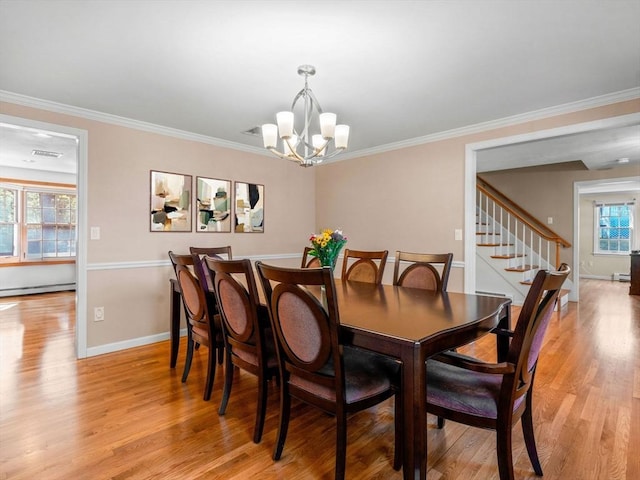 8 Kennedy Ln, Acton, MA 01720 - dining space featuring a chandelier, light wood finished floors, baseboards, baseboard heating, and ornamental molding