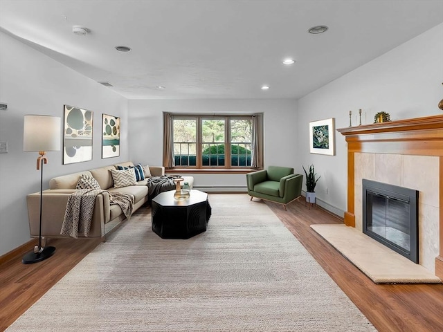 8 Kennedy Ln, Acton, MA 01720 - living area featuring wood finished floors, baseboards, a tile fireplace, and recessed lighting