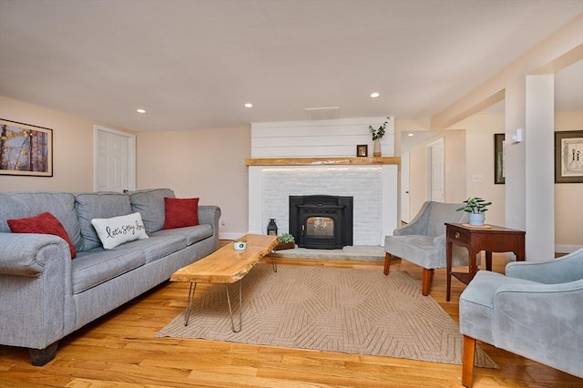 living area with recessed lighting and light wood-type flooring